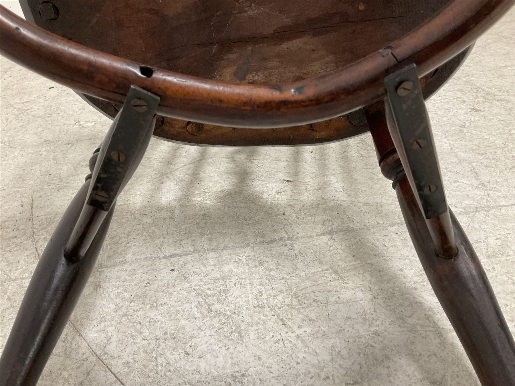 19th century yew wood and elm Windsor chair, low hoop stick back with pierced splat, dished seat raised on ring turned supports joined by crinoline stretcher