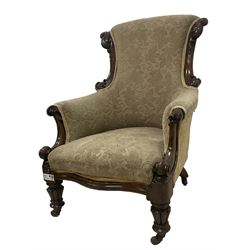 William IV mahogany framed armchair, rolled back with scroll carved uprights, acanthus carved arm terminals over serpentine fronted seat, raised on turned and lobe carved supports with castors