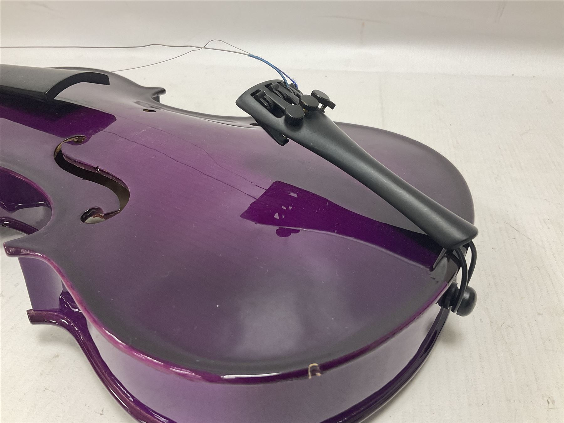 Intermusic 3/4 violin with a violet coloured solid wood body, ebonised fingerboard and fittings, bow and hard case, length 54cm