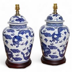 Pair of table lamps of baluster form, decorated with decorated with dragons chasing flamin...