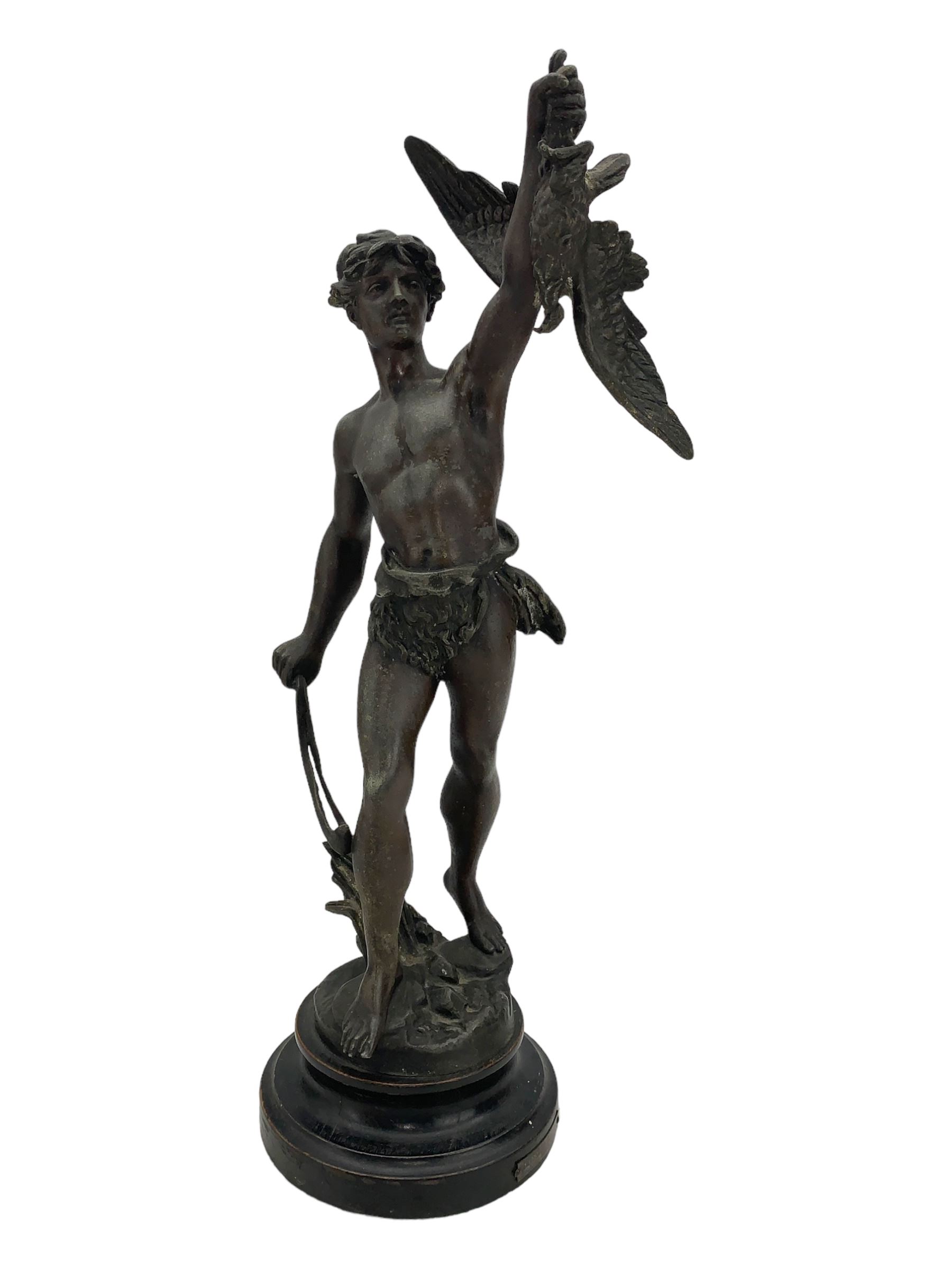 19th century French spelter figure 'Chasseur D'Aigles' on wooden base H48cm and a beaten copper circular tray inscribed with initials D61cm