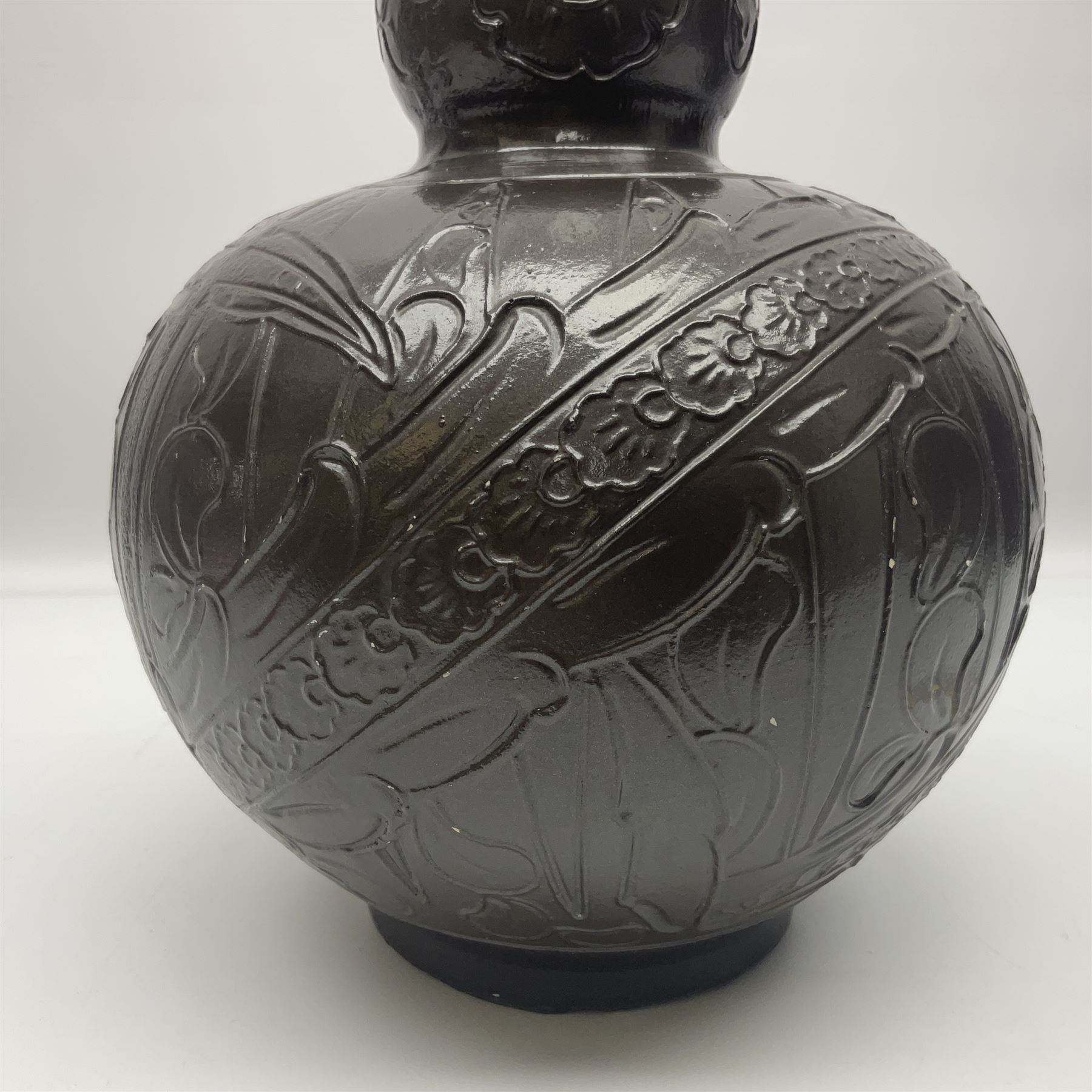 Burmantoft vase with slender neck, tubeline decoration on a brown ground, with impressed mark beneath, H38cm