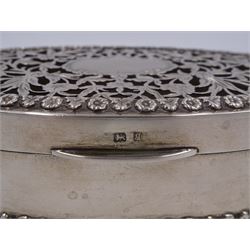 Edwardian silver trinket box, of navette form, the hinged cover with pierced floral and foliate decoration, and blank cartouche, hallmarked George Nathan & Ridley Hayes, Birmingham 1915 and stamped to base Pearce & Sons Silversmiths Leeds & York, W15.5cm, H3.5cm, 