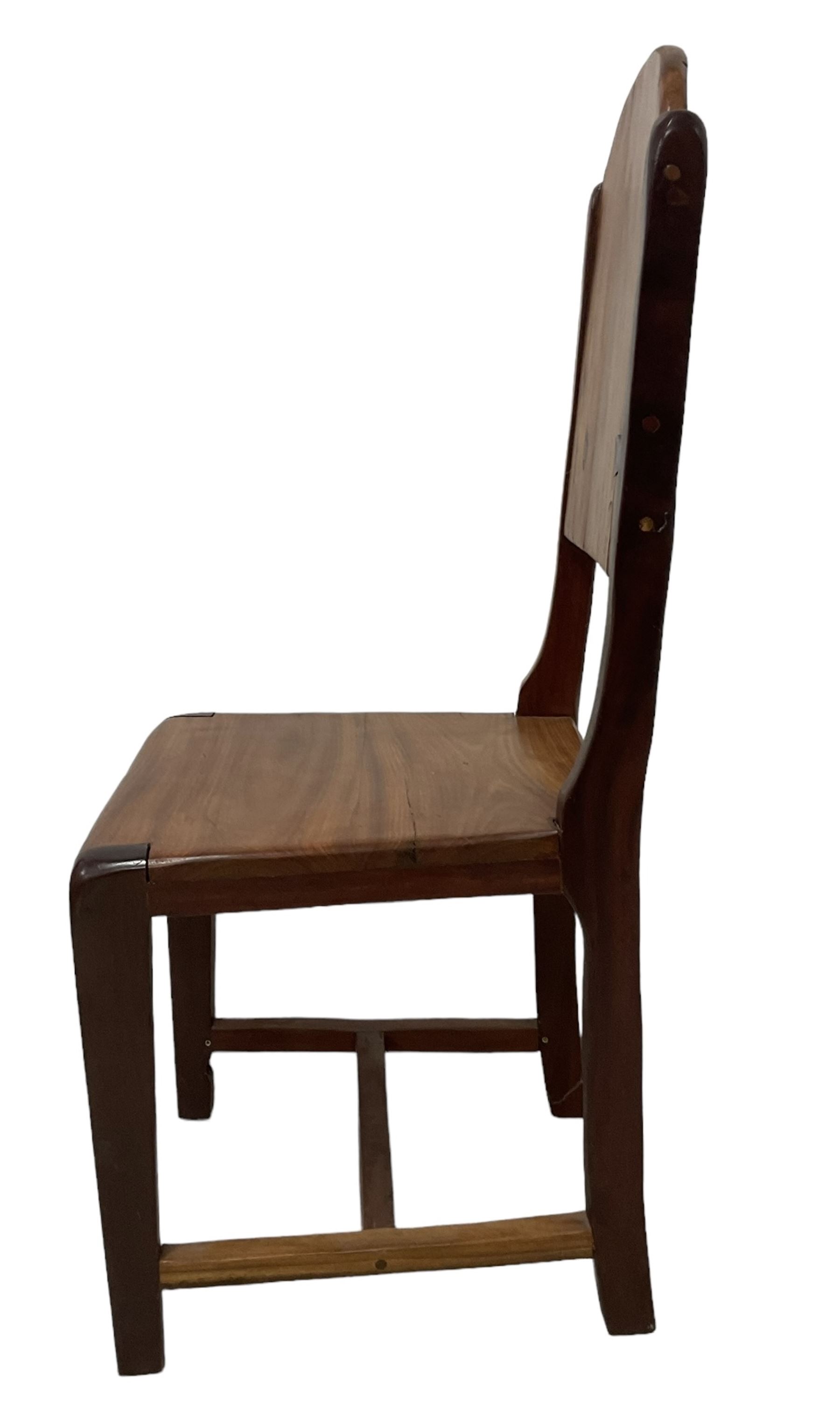 Mid-to-late 20th century teak dining table, rectangular top with canted corners, on square tapering supports with spade feet (214cm x 119cm, H76cm); and a set of eight Burmese reclaimed teak dining chairs, high arched back over panelled seat