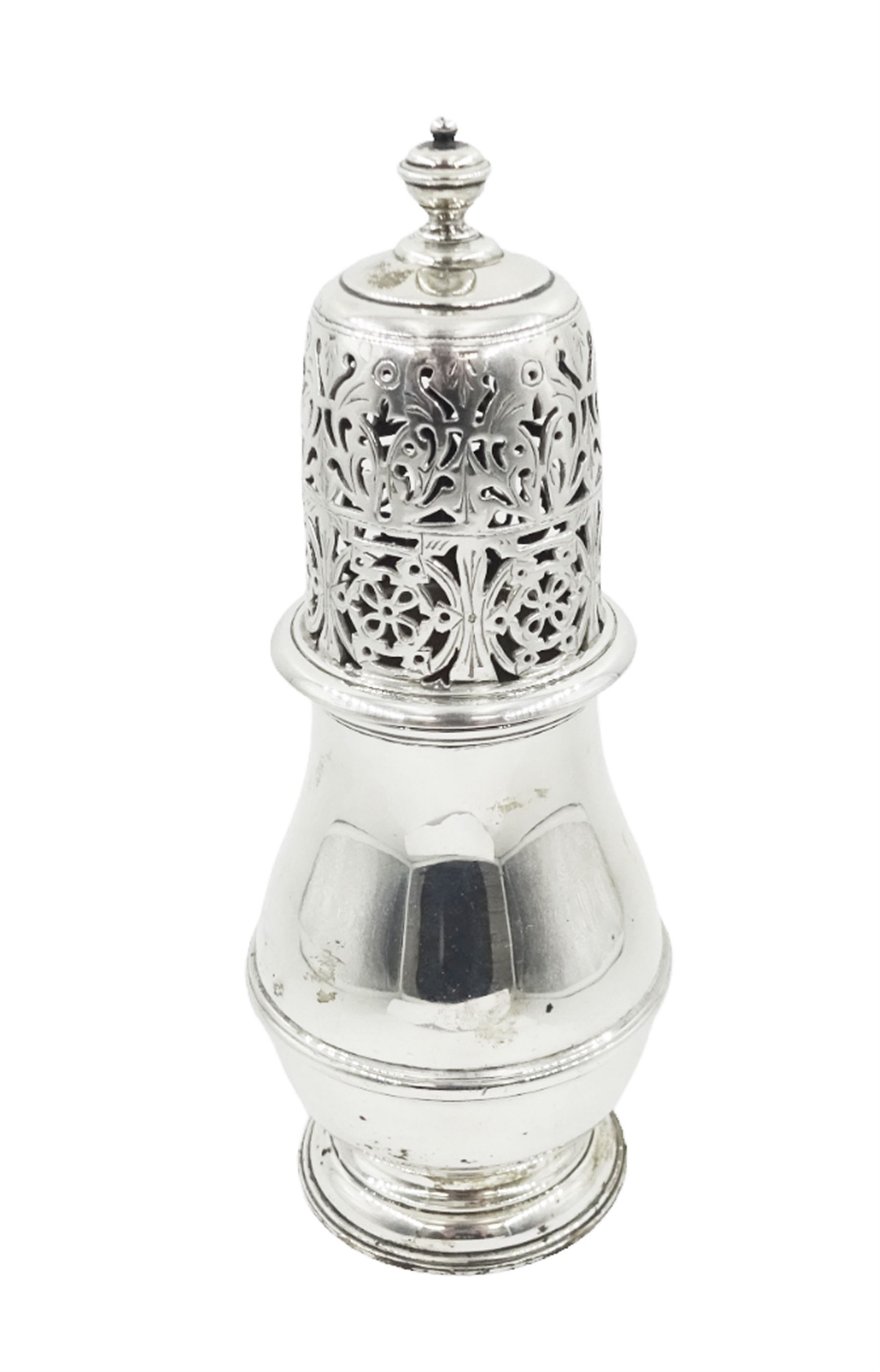 1920s silver sugar caster, of typical waisted form, the removable pierced floral cover with urn finial, hallmarked Charles Perry & Co, Chester 1929, H17cm