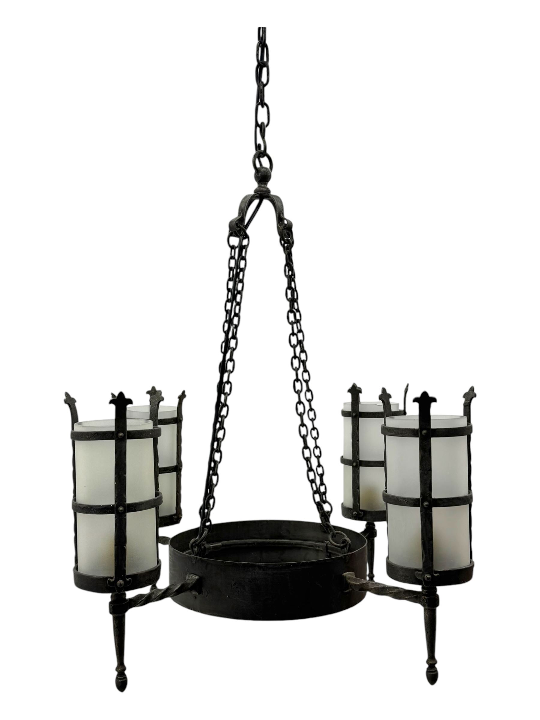 Wrought metal ceiling light, four branch with strapwork lanterns (D55cm); together with a pair of matching wall sconces (H32cm)