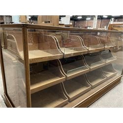 20th century oak and glazed haberdashery shop's display cabinet, fitted with twelve slides, on skirted base - THIS LOT IS TO BE COLLECTED BY APPOINTMENT FROM THE OLD BUFFER DEPOT, MELBOURNE PLACE, SOWERBY, THIRSK, YO7 1QY