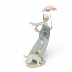 Lladro figure, Lady with Shawl, modeled as a woman holding a parasol with an afghan hound,...