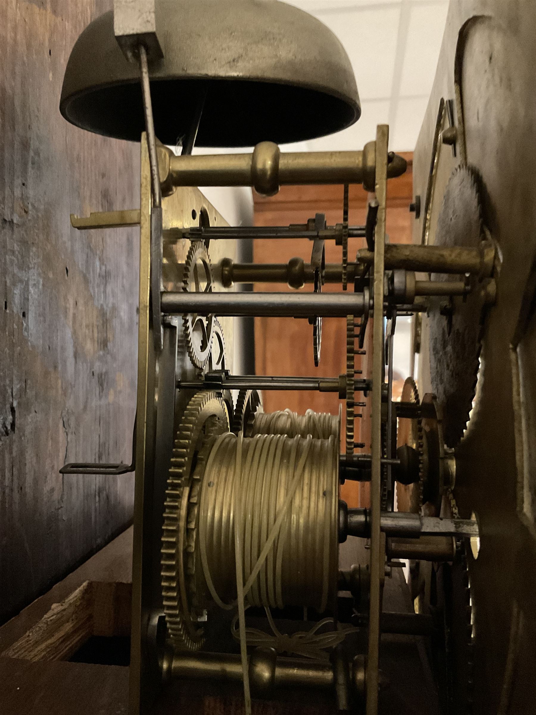 8-day - profusely carved oak longcase, with a flat top and square hood door beneath, door flanked by barley twist columns with brass capitals, trunk with reeded quarter columns and wavy topped door, on a carved plinth raised on bracket feet, brass dial with an engraved and matted dial centre, penny moon and date aperture, chapter ring inscribed “John Stancliffe” with Roman numerals and five-minute Arabic's, rack striking movement with a recoil anchor escapement. With pendulum and weights.