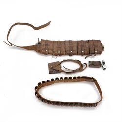 Brown leather bandolier with brass metal work stamped by T35  with three officers sword fr...