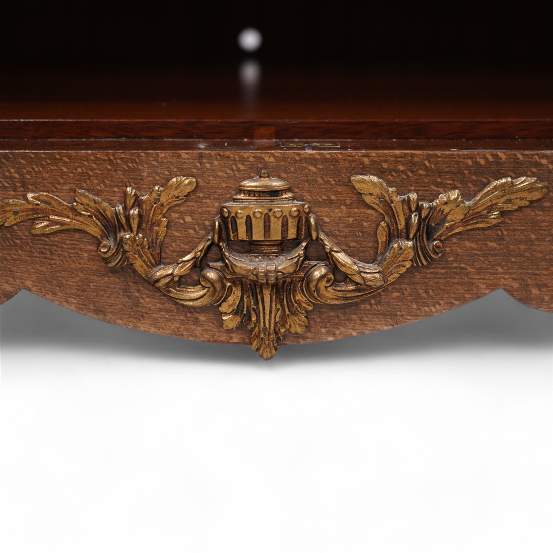 Mid-to-late 20th century mahogany and walnut side cabinet, shaped white and grey variegated marble top, single frieze drawer inlaid with scrolling leafy branches and flower heads, single internal shelf enclosed by two doors inlaid with flowers, decorated with cast gilt metal mounts, on cabriole feet 