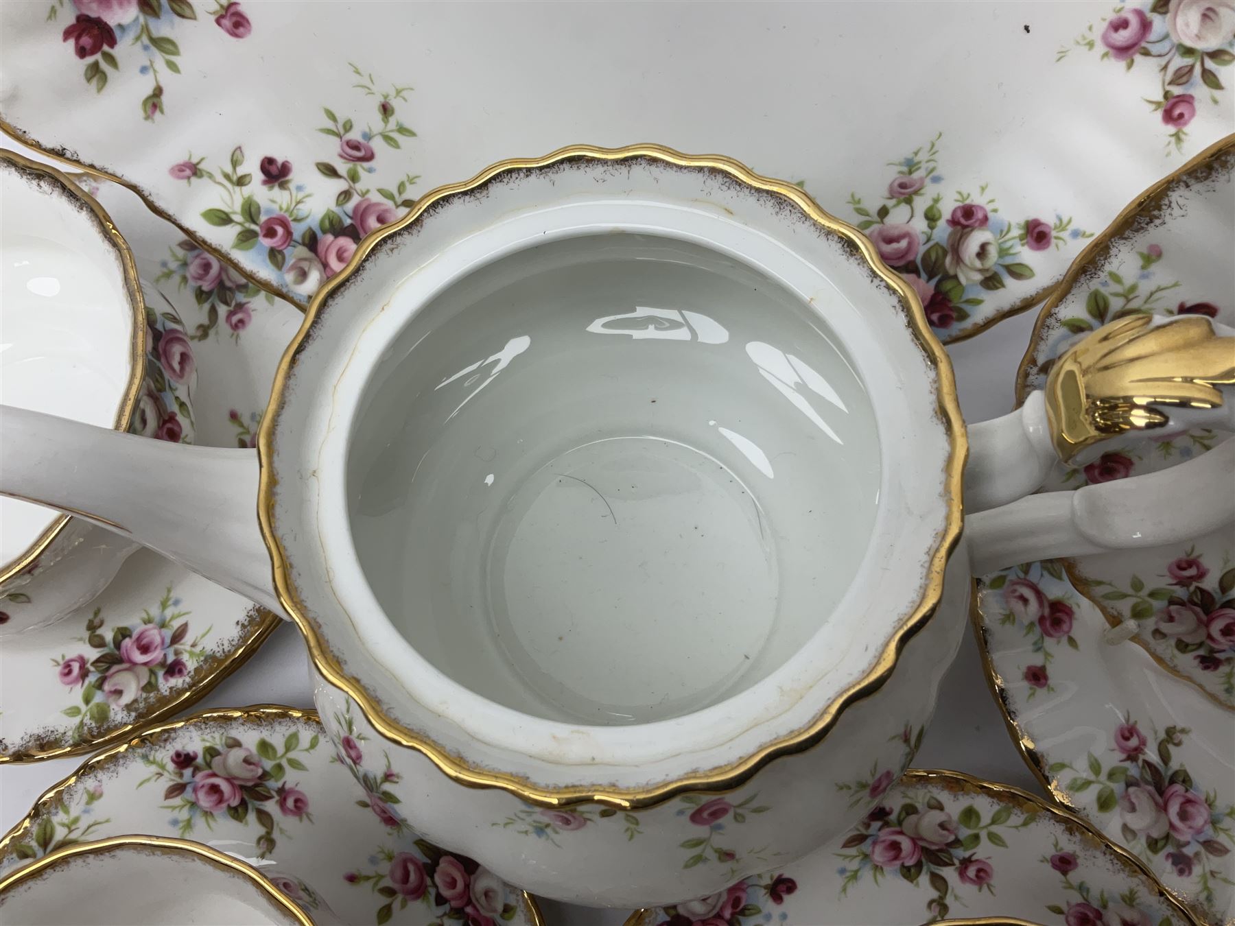 Royal Albert Cottage Garden pattern tea service for six people, comprising teapot, milk jug, sugar bowl, teacups and saucers, side plates and cake plate, all with printed mark beneath