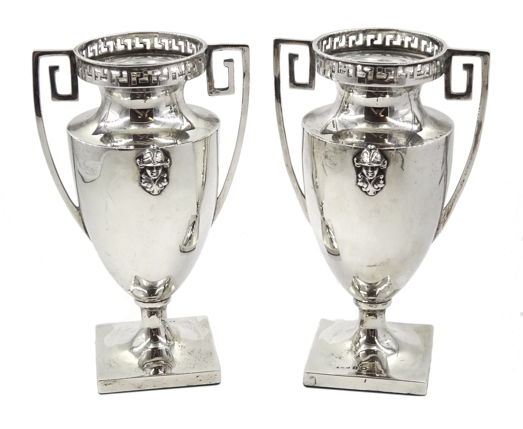 Pair of silver Neoclassical design urn shaped vases, with pierced key pattern top and handles by Charles Edwin Turner, Birmingham 1911, height 14.5cm