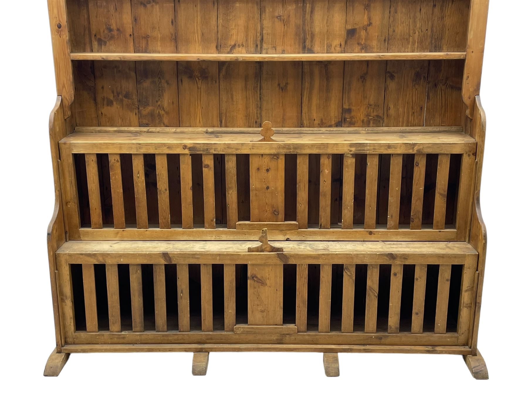 Waxed pine 'chicken coop' or 'hutch' dresser, projecting cornice over shaped frieze and three tier plate rack, the stepped waterfall lower section fitted with two slatted chicken coops, on sledge feet 