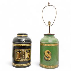 Two Victorian toleware shop display tea canisters, the first decorated in gilt with Chines...