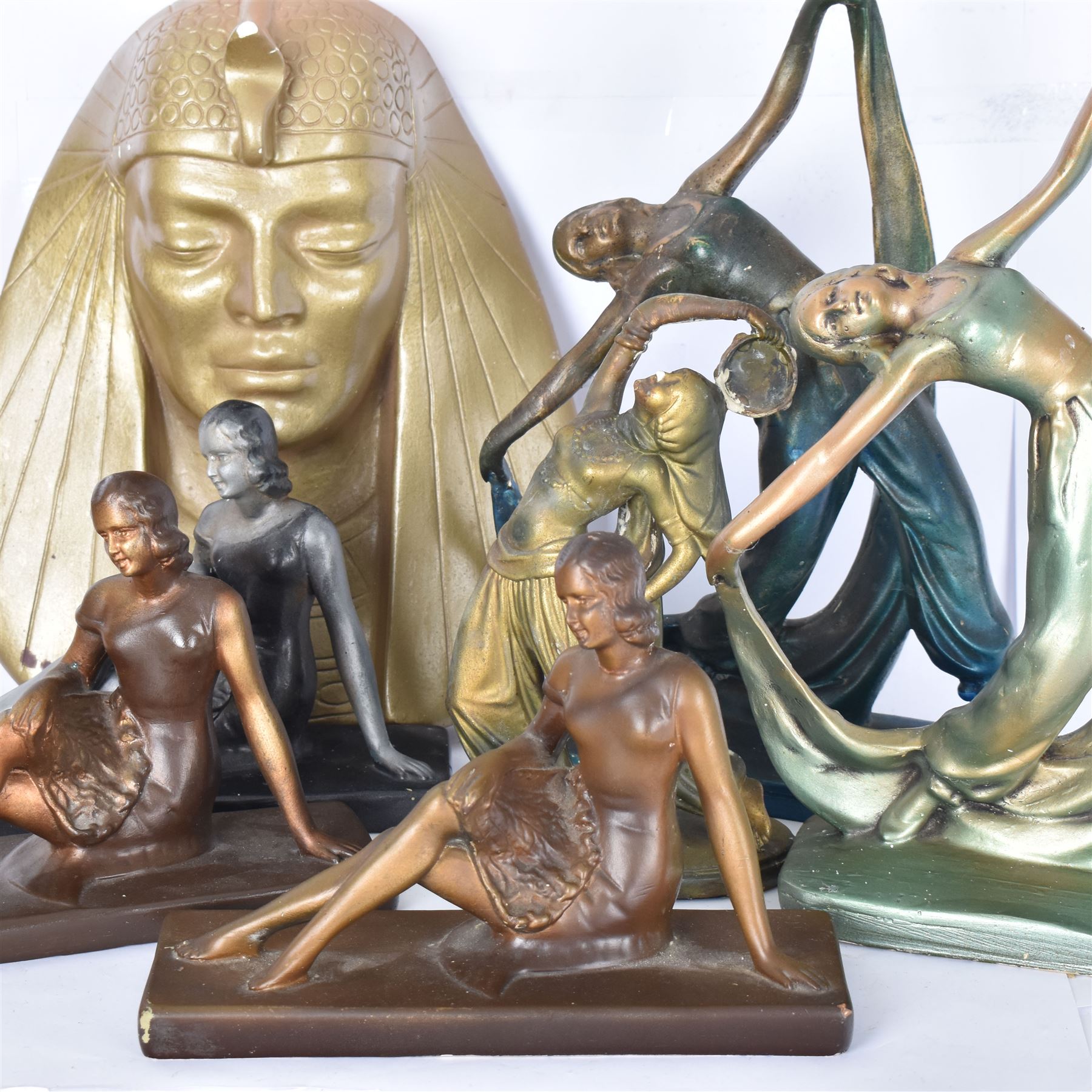 Collection of plaster figures, including three Art Deco style ladies, two dancers, pharaoh mask and one other