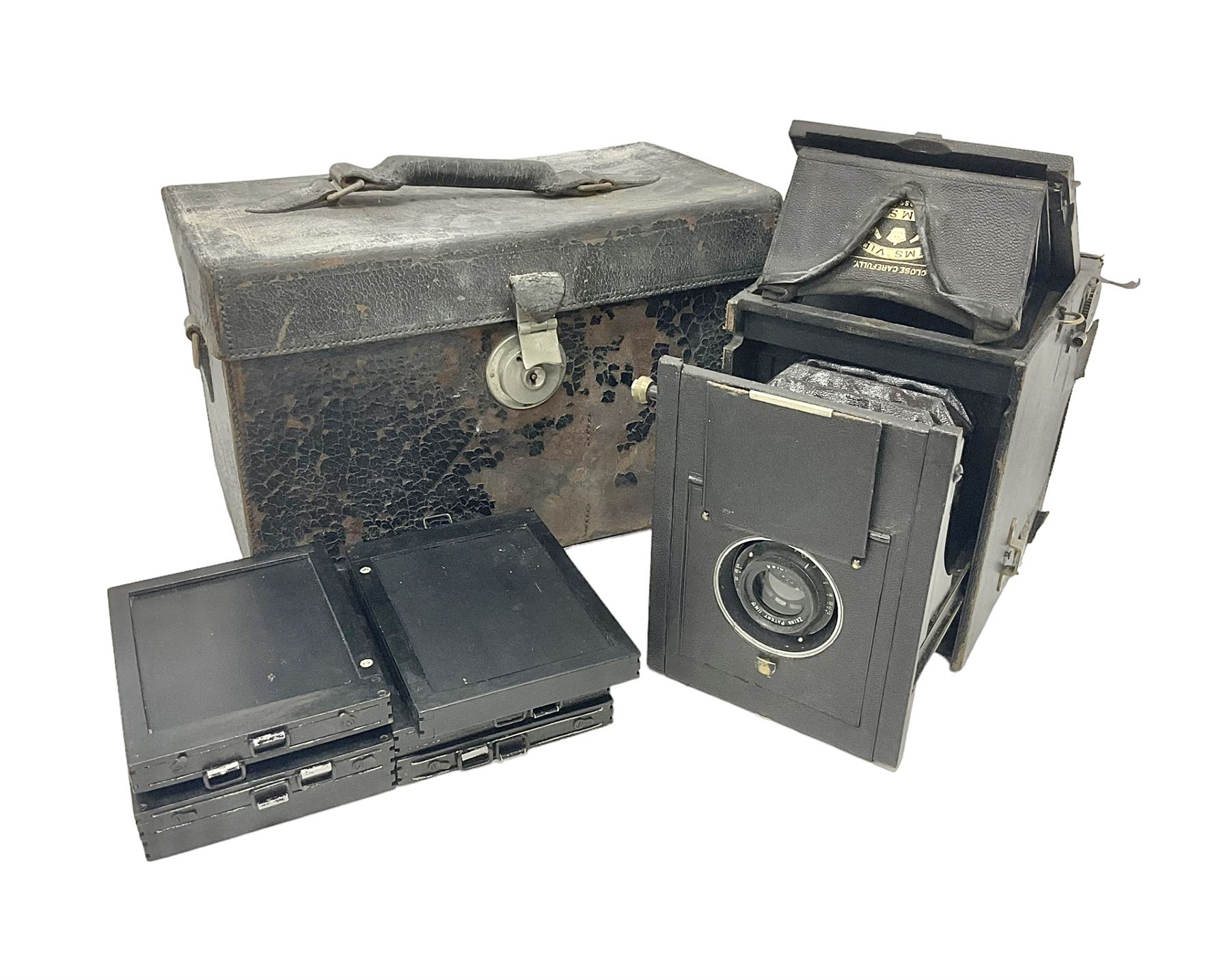 Early 20th century Adams and Co 'Videx' folding plate camera, in original leather carrying case, with various quarter plates