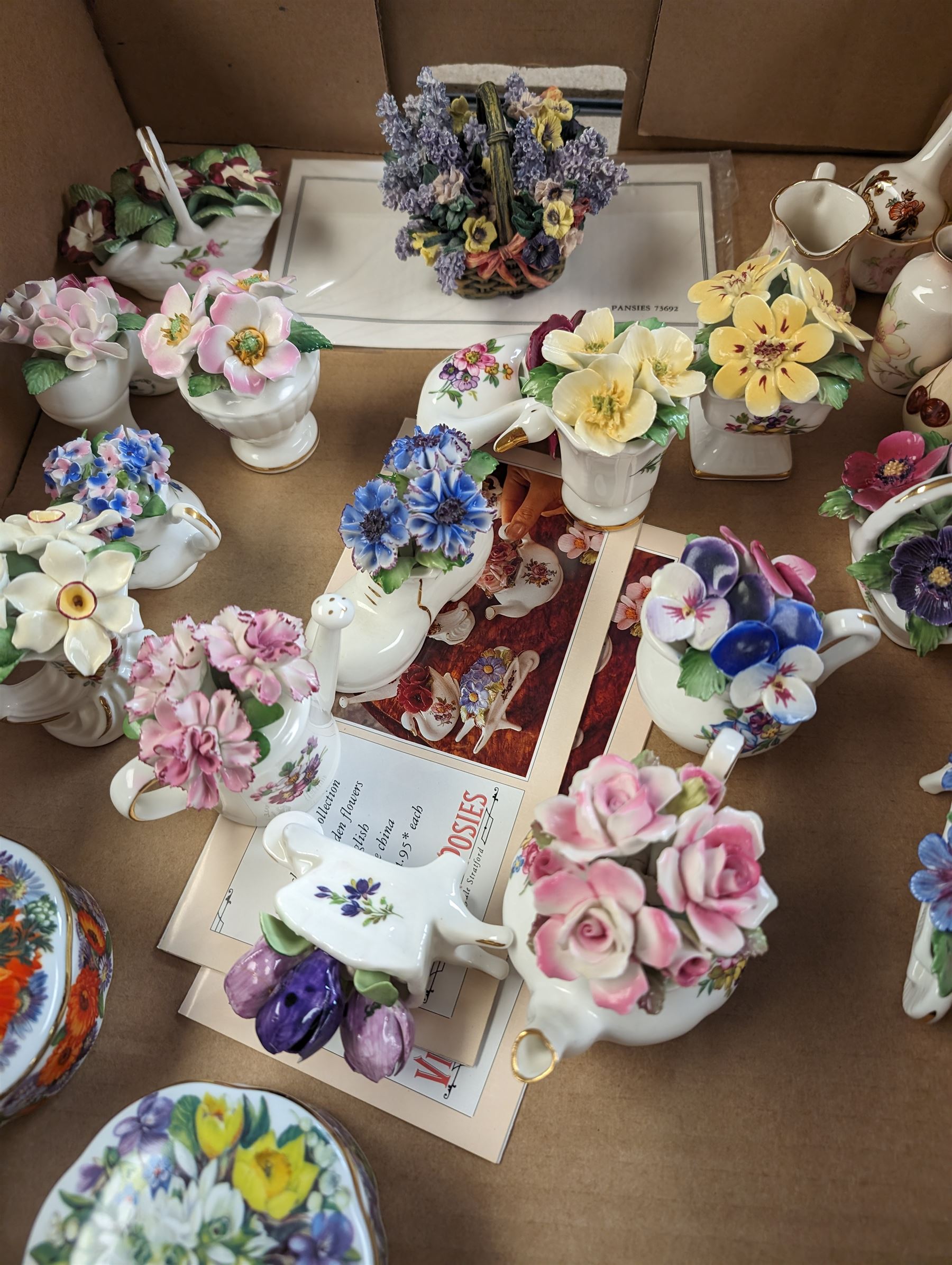 Four Ardleigh Elliott musical trinket boxes and one musical flower basket, four with boxes, together with ceramic flower baskets and posies, by various makers