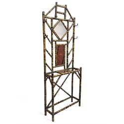 Victorian bamboo hallstand, bevelled mirror over red lacquered and chinoiserie decorated panels, fitted with six brass hooks 