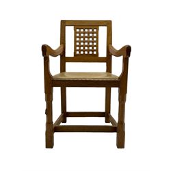 Rabbitman - set of six (5+1) oak dining chairs, pierced and carved lattice back, leather upholstered seat with stud band, on octagonal supports united by stretchers, carved with rabbit signature, by Peter Heap of Wetwang 