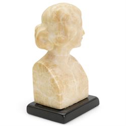 Early 20th century alabaster of a young girl, wearing a ribbon in her hair, on a black marble base, H19.5cm and another carved female bust on an ebonised base, H20.5cm (2)