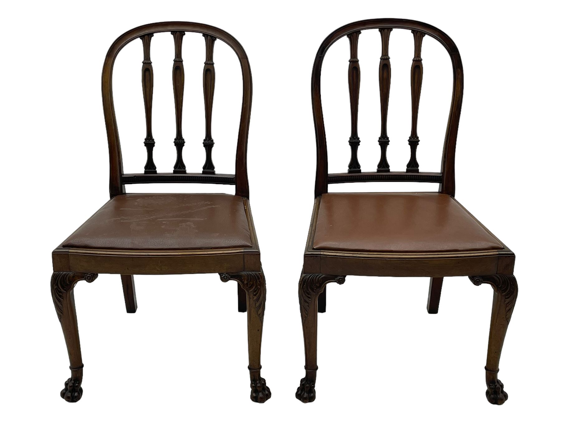 Set of six early 20th century Hepplewhite design mahogany dining chairs, moulded arched frame back, three shaped vertical rails carved with stylised foliate decoration, drop-in seats upholstered in brown fabric within moulded seat rails, on acanthus leaf carved cabriole supports with paw carved terminals 