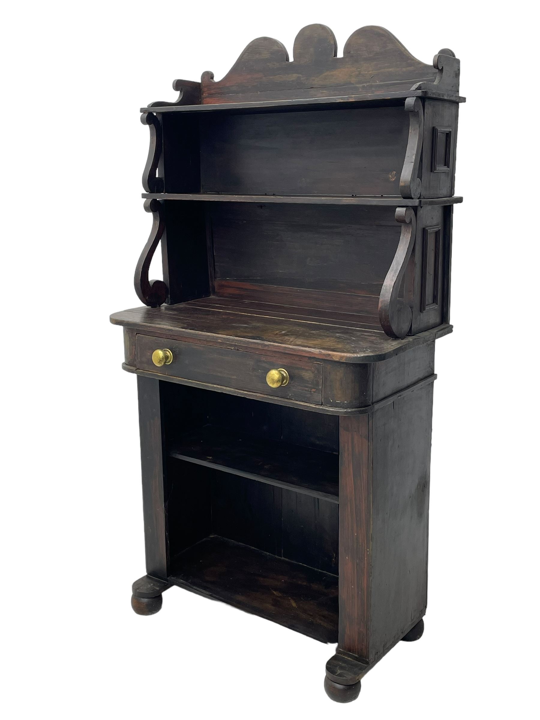 Victorian scumbled pine chiffonier, raised shaped back fitted with two shelves on S-scroll supports, rectangular top with rounded corners over single frieze drawer and open shelf, on projecting rounded sledge platforms and compressed bun feet, scumbled to resemble rosewood 