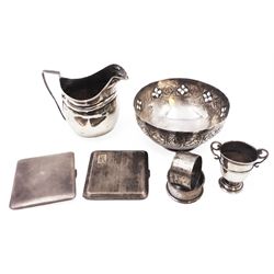 Group of silver, comprising milk jug, miniature trophy, napkin rings and cigarette cases, all hallmarked together with a continental silver bowl with pierced sides, jug H10cm