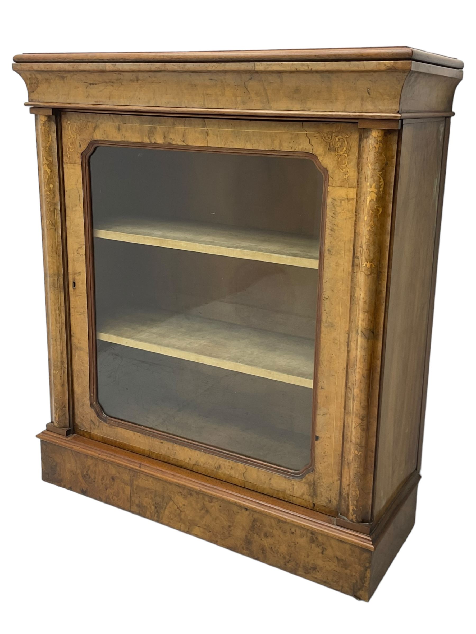 Victorian inlaid walnut pier display cabinet, moulded rectangular top over cavetto frieze, the moulded upright inlaid with scrolling foliage, fabric lined interior fitted with two shelves enclosed by single glazed door, on moulded plinth base 