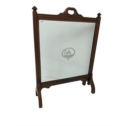 Late 19th century mahogany and glass fire screen, moulded frame enclosing glass panel with central Camel scene within desert landscape decorated with pyramids and trees, foliage carved handles with central ring turning, on splayed moulded supports