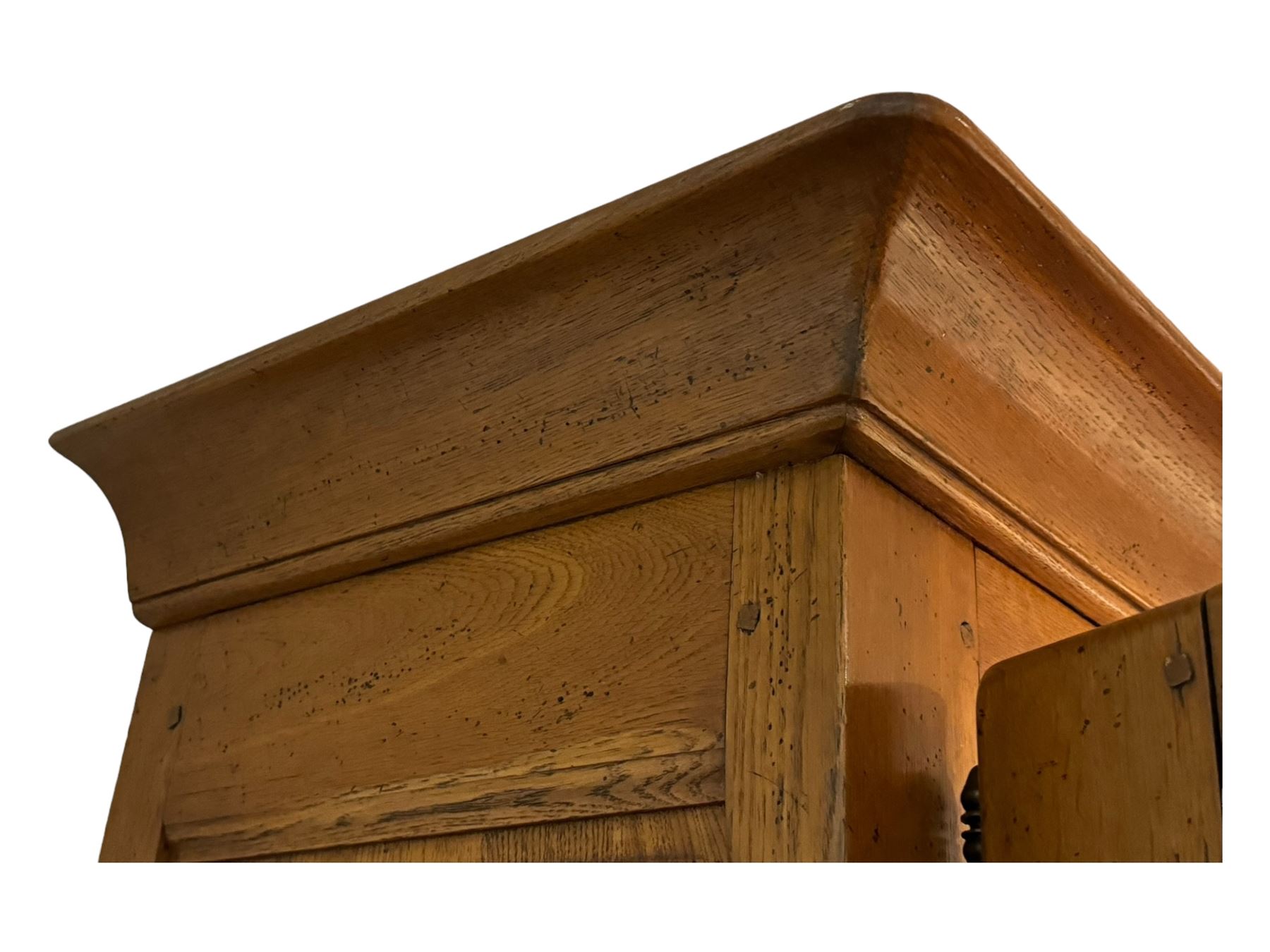 Large 20th century oak dresser, projecting cornice over open arched central section with two shelves, flanked by two panelled cupboards with two shelves, lower section with three drawers above three cupboards, on stile supports 