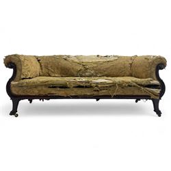 19th century mahogany settee, rolled S-scrolled arms carved with lion masks and acanthus leaf scrolls, the lower moulded rail carved with scrolling design, raised on carved paw feet with recessed brass and ceramic castors 