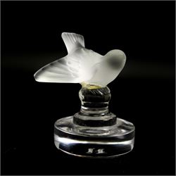 Lalique glass to include three pin dishes surmounted with swans, lovebirds and wren, another figure of a wren on circular base and a Nina Ricci dove perfume bottle, H9cm (5)