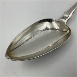 George III Exeter silver Fiddle pattern serving spoon, the terminal engraved with crest of a fist holding an arrow, hallmarked George Turner, Exeter 1816, L29cm