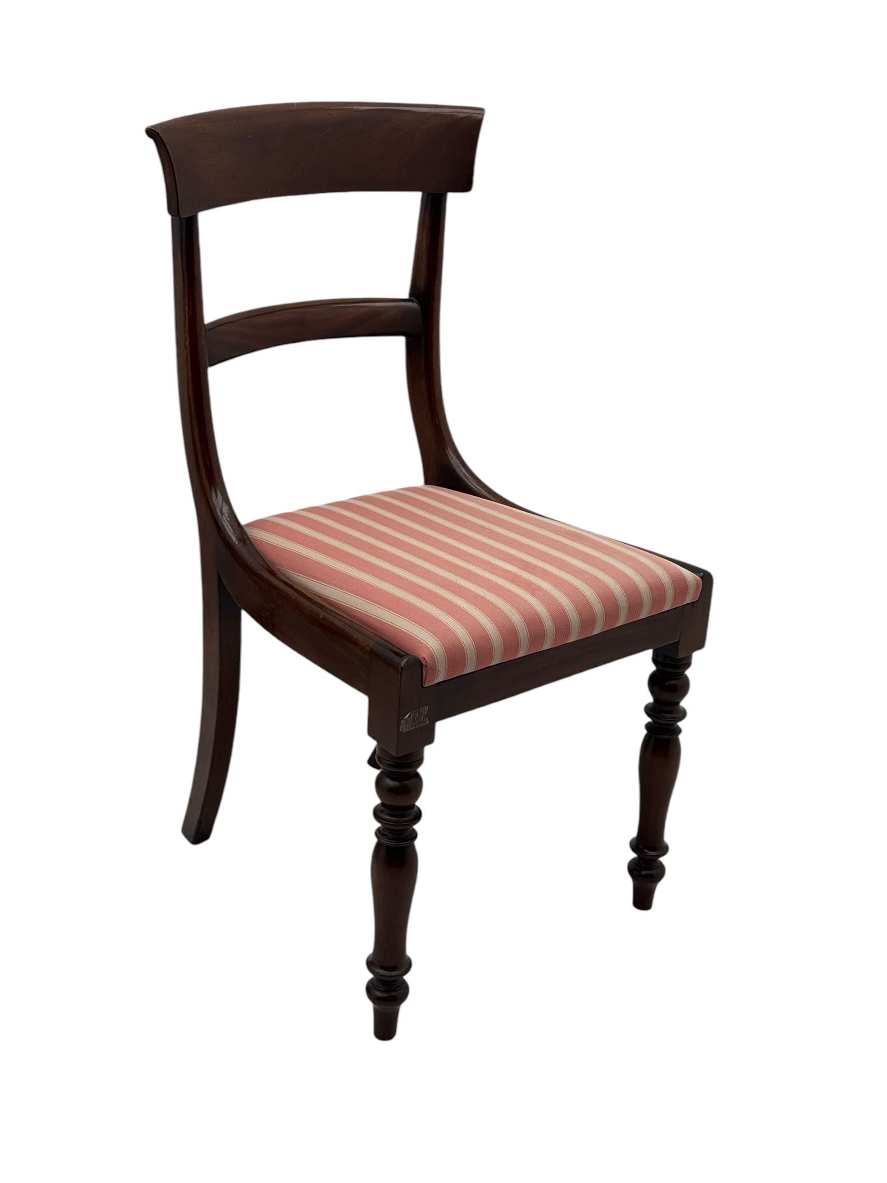 Set of six Victorian mahogany dining chairs, curved bar back over drop-in seat upholstered in striped fabric, on turned front supports