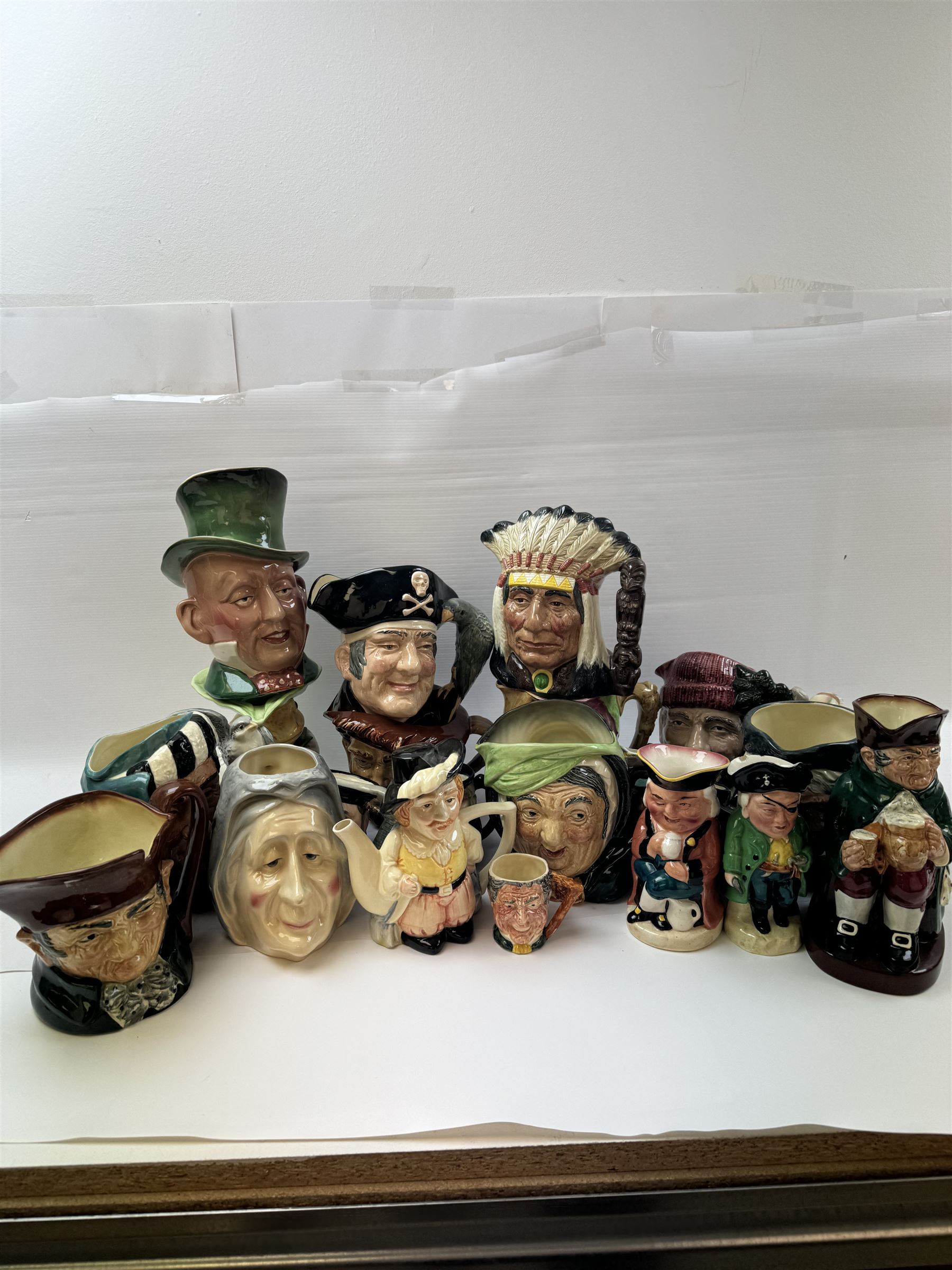 Collection of character jugs, including Royal Doulton Long John Silver, The Falconer, Granny etc