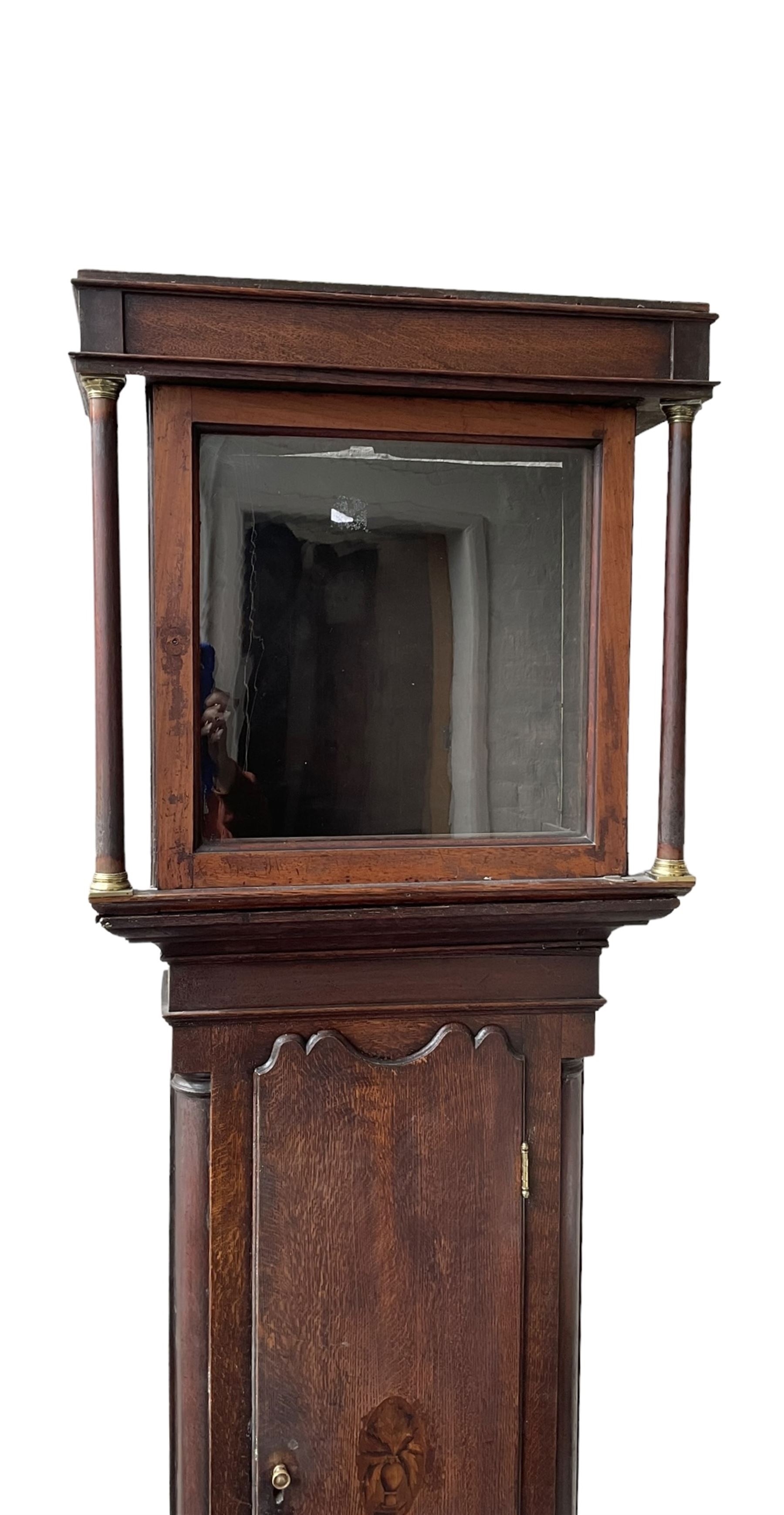 Empty oak longcase converted into a cupboard with shelves.