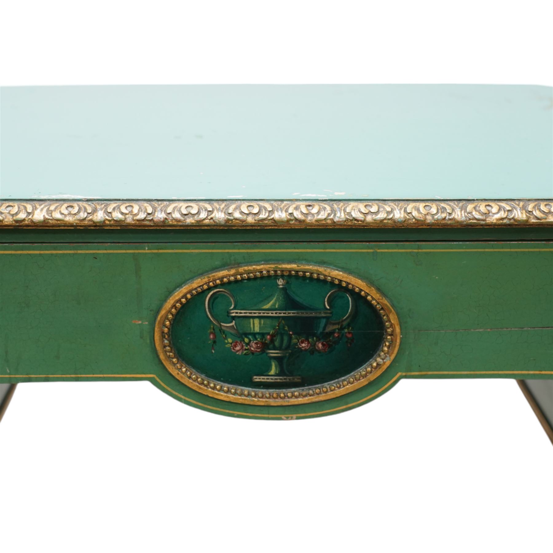 Edwardian Adam Revival green-painted and parcel gilt kneehole desk or dressing table, kidney shaped form with foliate carved edge, fitted with three drawers painted with urn and fruiting laurel wreaths with ribbon ties, on acanthus leaf and draped festoon decorated turned supports 