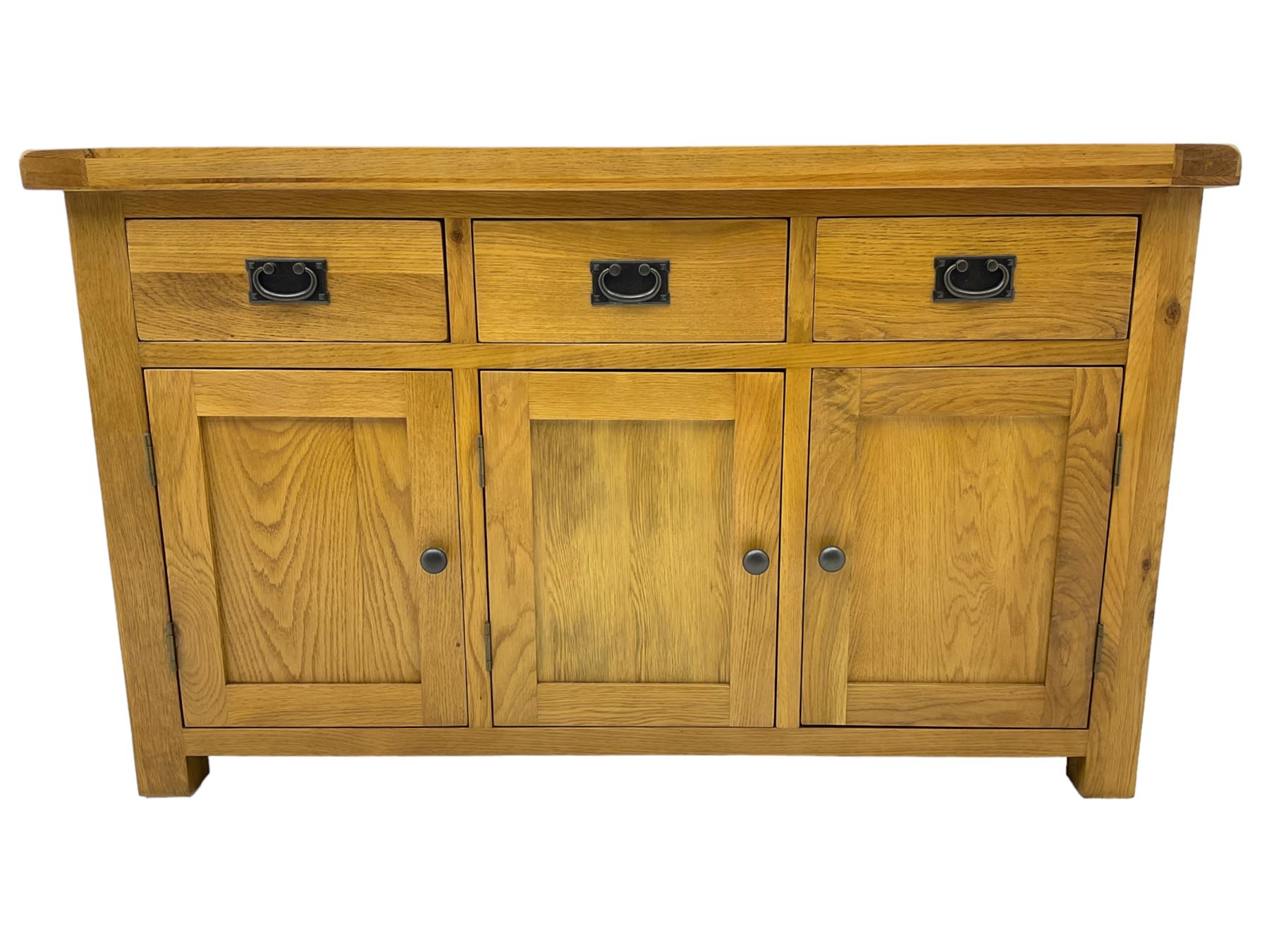 Contemporary light oak sideboard, fitted with three drawers over three panelled cupboards enclosing shelving, on square supports