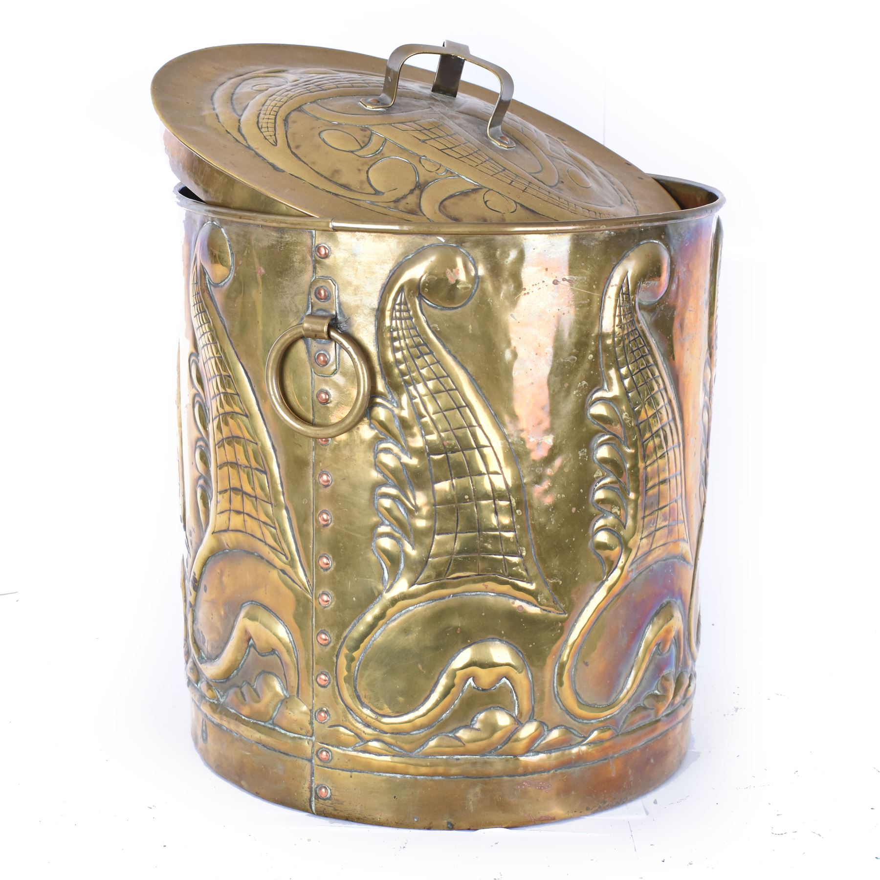 Arts and Craft brass coal box of cylindrical, with embossed stylised leaf panels, with twin handles, the cover with triform handle, H42cm 