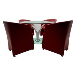 Rolf Benz glass dining table, circular bevelled glass top supported by central Y-shaped brushed metal column, terminating in circular glass base; four red leather tub chairs with curved backrests and vertical stitching, on round chrome feet (5)