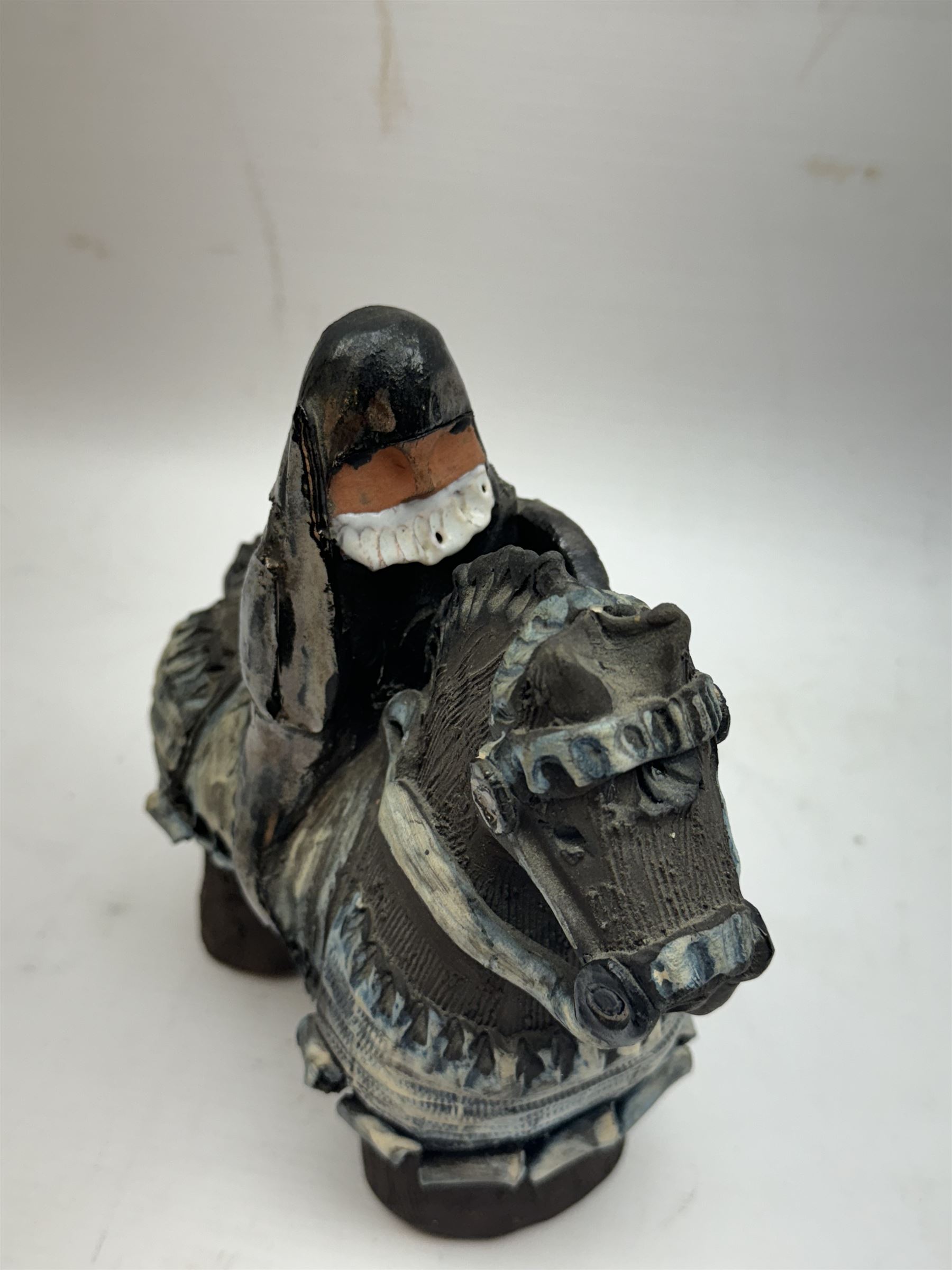 Studio pottery figure, modelled as a knight on horseback, H16cm