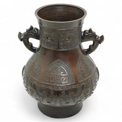 Large Asian bronze Archaic form vase with mask handles, geometric arched panels etc, with ...