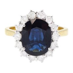 18ct gold oval cut sapphire and round brilliant cut diamond cluster ring, 