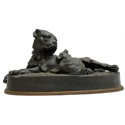 After W. Wolfe; bronze cast figural group depicting bullmastiff feeding puppies, signed with impressed mark to the front, on oval wooden base, H20cm