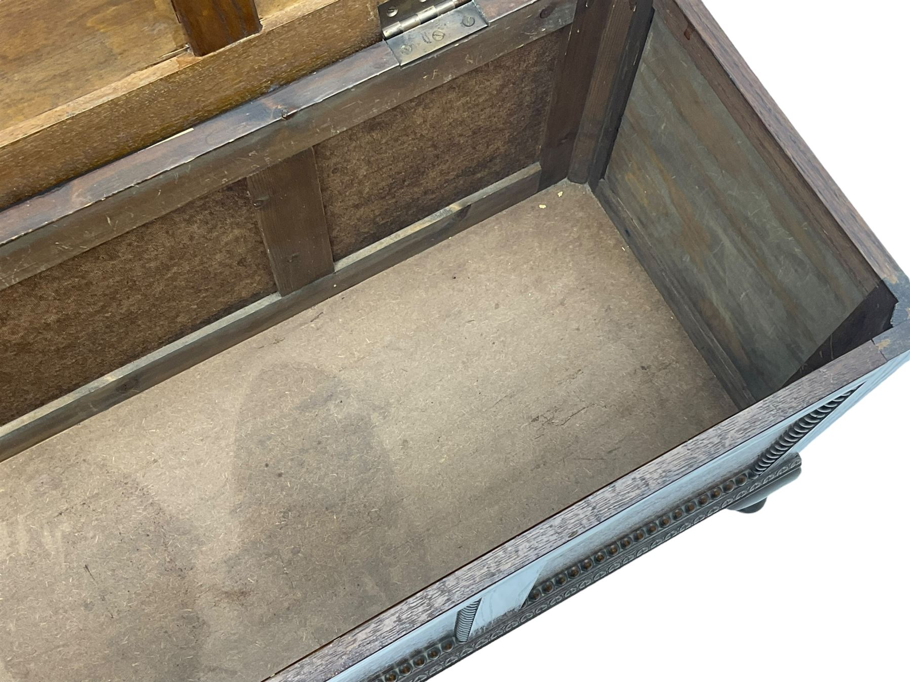 Early 20th century oak blanket chest, rectangular hinged lid with decorative panelling, the front and sides adorned with beaded panels, on cabriole feet