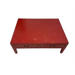 Chinese design red lacquered coffee table, rectangular form on square tapering supports, fitted with two drawers 