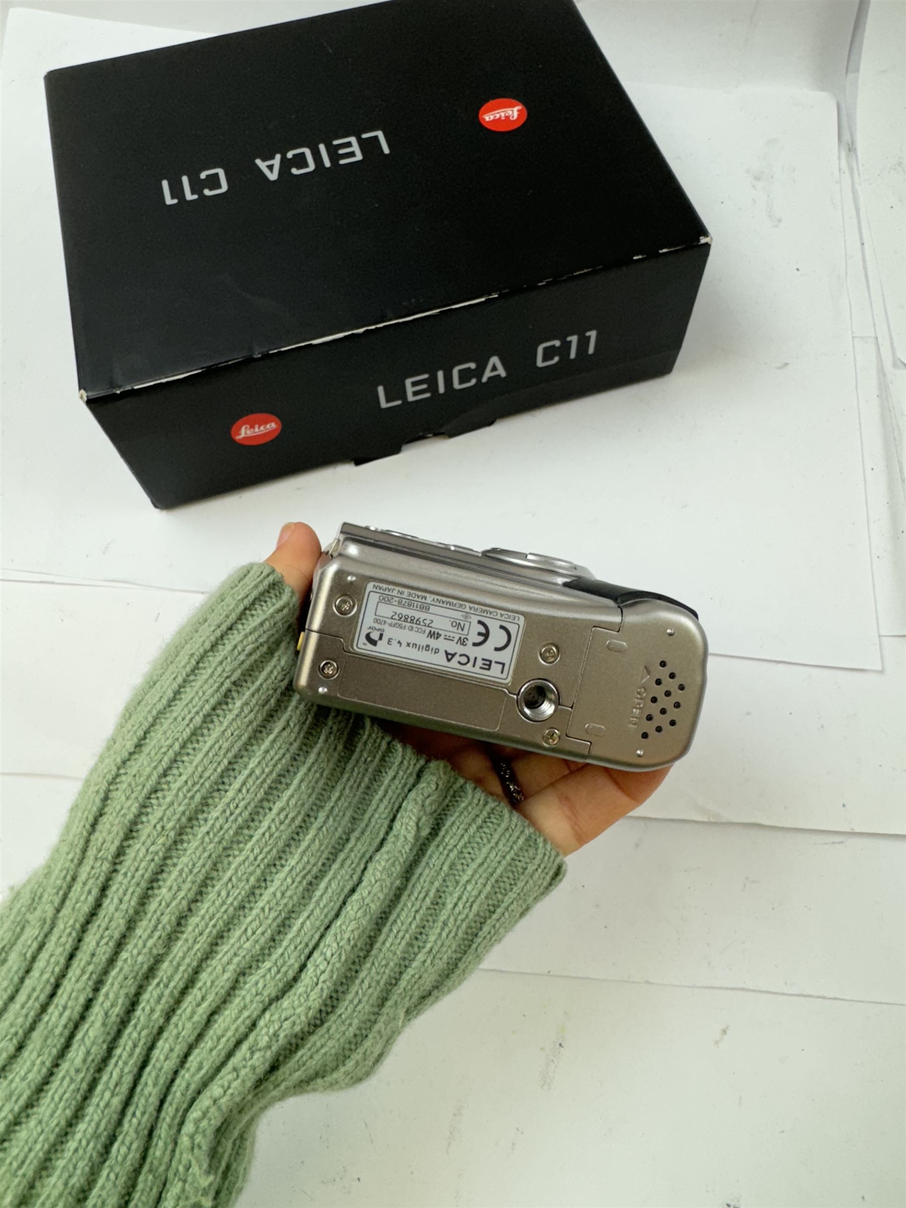 Leica C11 APS film compact camera, in silver and chrome finish, serial no. 2636834, in original clear hard case and box, with instruction booklet, together with a Leica Digilux 4.3, with 1:2.8-4.5/8.3-24.9mm lens, serial no. 2598862, with instruction booklet