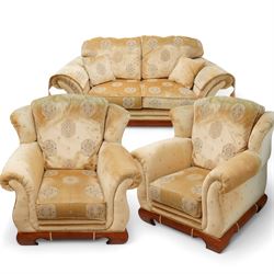 Three-seat sofa (W197cm, D103cm) and pair of matching armchairs (W100cm); upholstered in pale gold fabric decorated with Gul motifs, hardwood framed with polished base