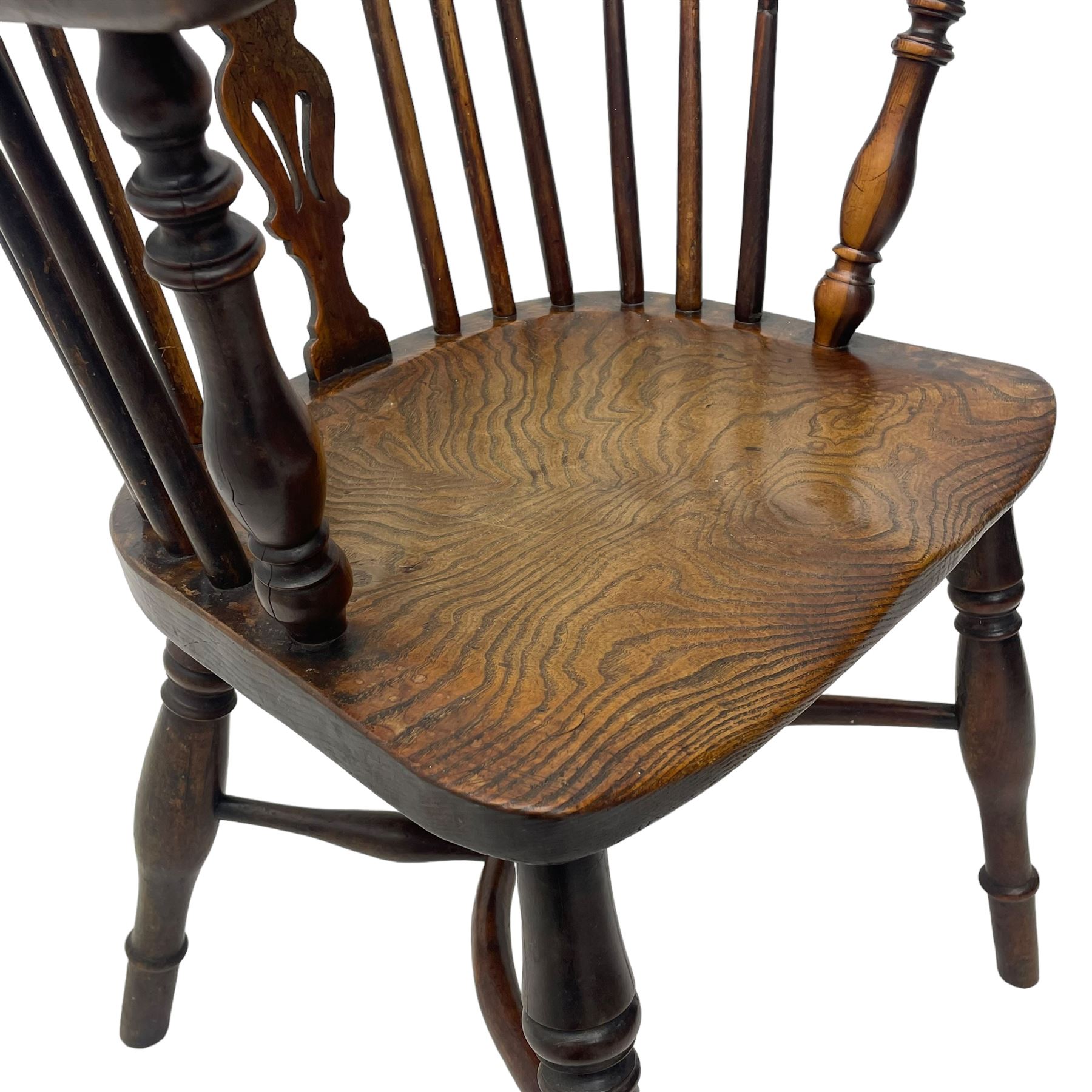 19th century yew wood and elm Windsor armchair, low double hoop stick and pierced splat back, dished seat on turned supports united by crinoline stretchers